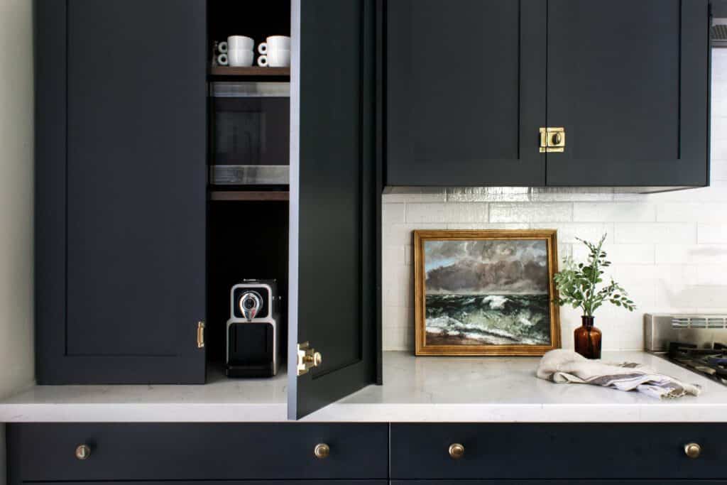 Appliance garage storage behind cabinet doors