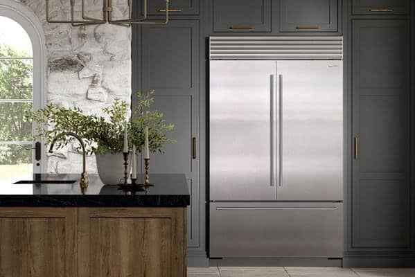 Built-In Sub-Zero Refrigerator In A Grey Kitchen
