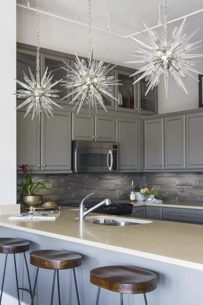 Starburst pendant lights in grey kitchen 