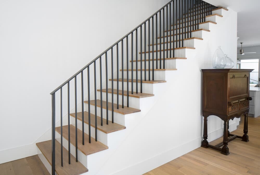 Straight Staircase With Grey Treads And Simple Black Metal Railing