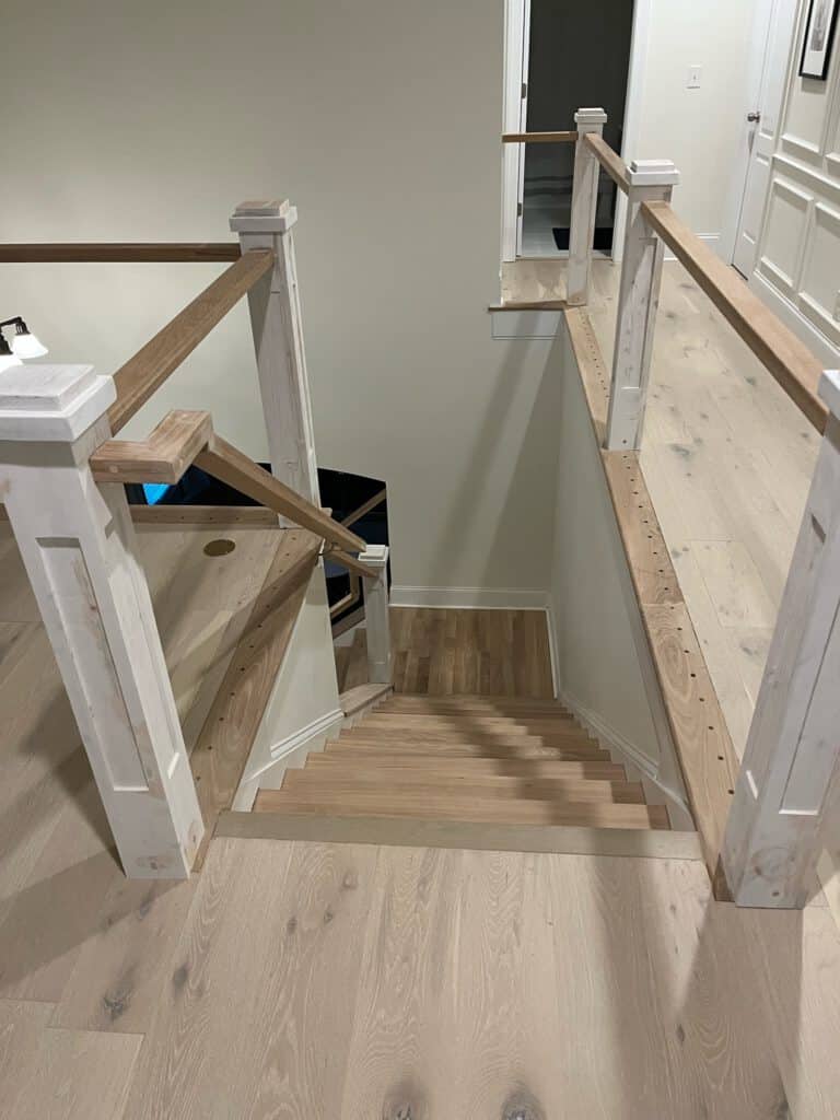 Newel posts and banister installed on stair renovation