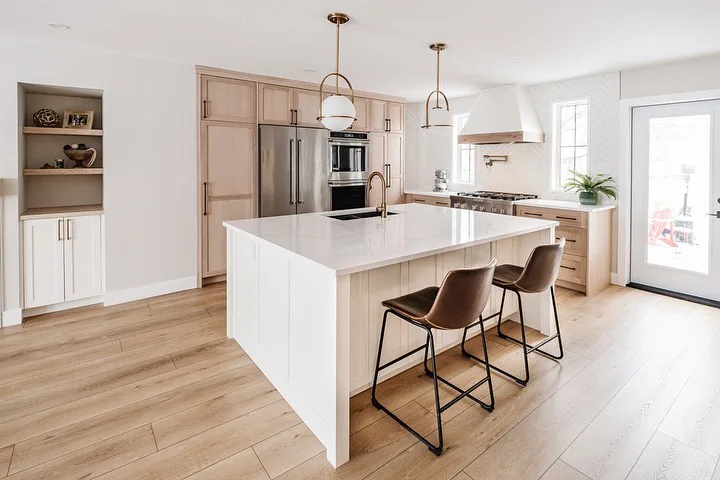 White island with white oak kitchen cabinets