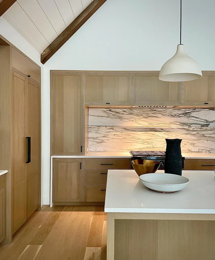 Marble backsplash with white oak cabinets