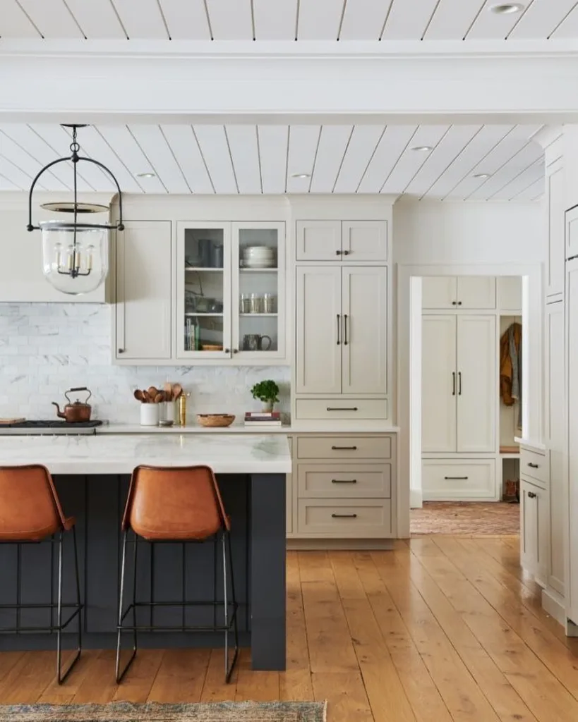 Farmhouse white shiplap ceiling in a cream colored kitchen