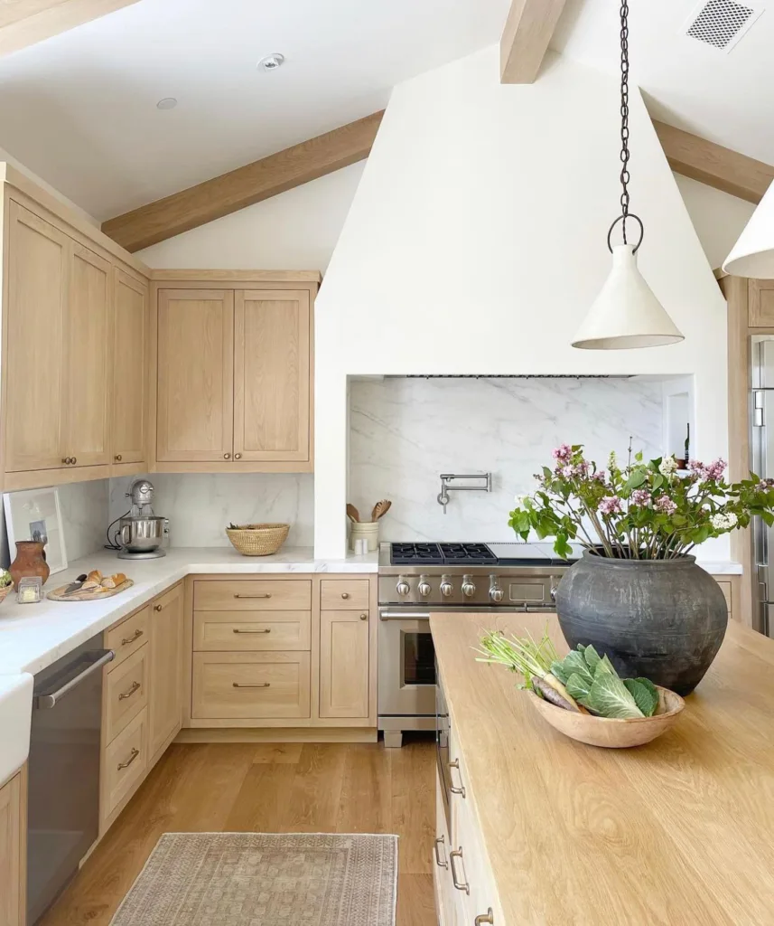 large white hood with white oak inset cabinets