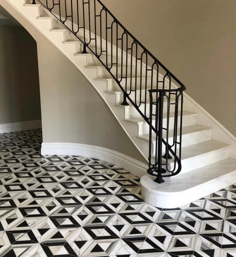 31 Black And White Stairs That Are Sure To Stun 30 White Marble Curved Steps With A Black Railing In An Entryway