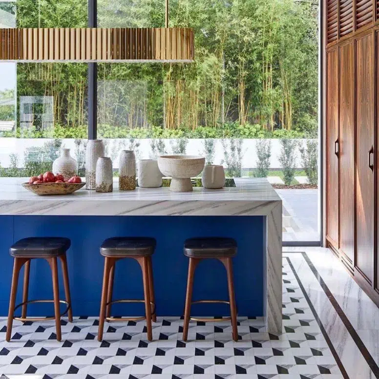 32 Waterfall Kitchen Island Ideas For Inspiration 31 Thick Polished Countertop On A Waterfall Island With A Blue Accent And Wood Cabinets Around The Kitchen