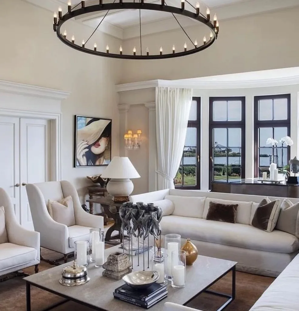 A Black And White Coastal Living Room That Matches The Black Trim Around The Windows Overlooking The Ocean View