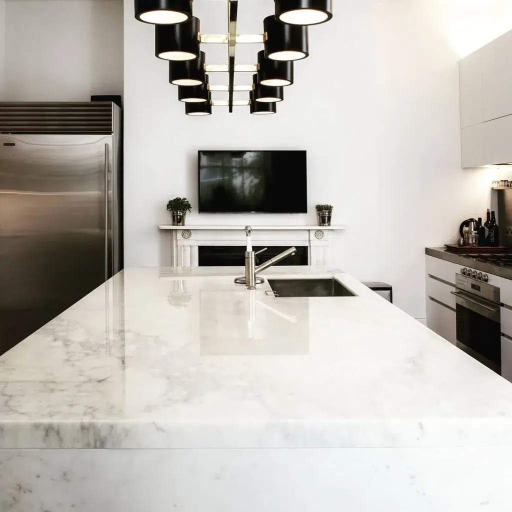 A Waterfall Edge Marble Countertop With Straight Cut Edges That Show A Seam