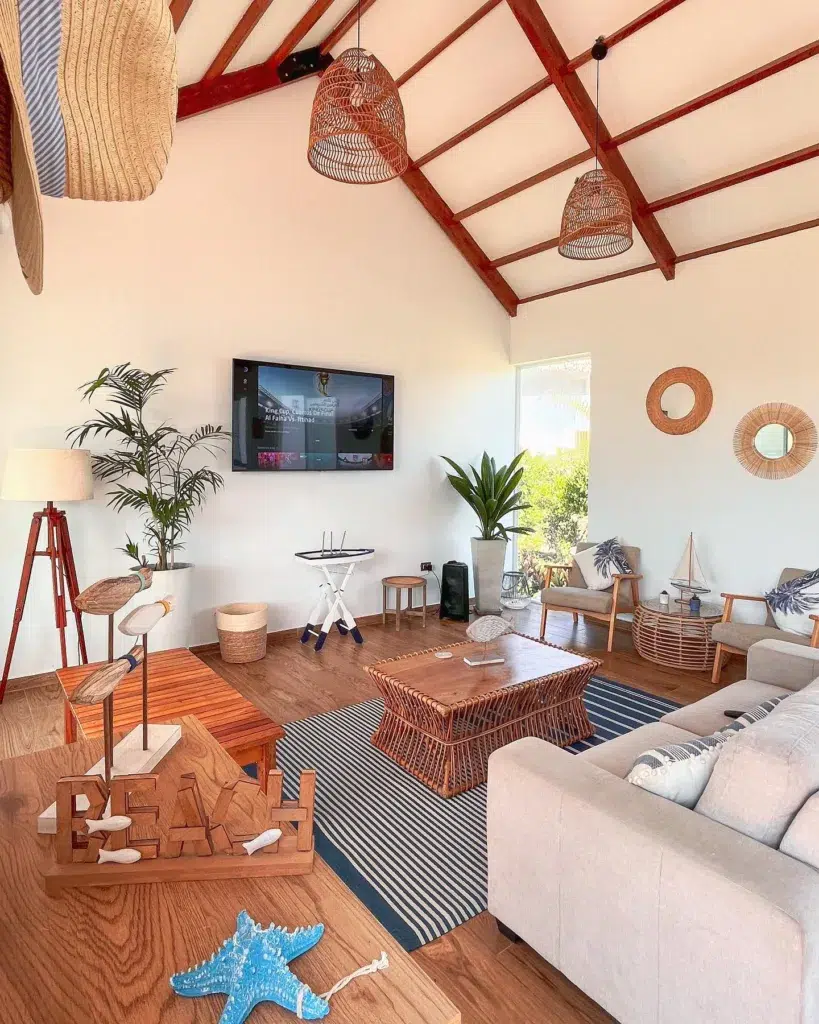 31 Coastal Beach-Themed Living Room Ideas 8 Brown Wood Beams And Tables In A Living Room With A Hawaiin Beach Style