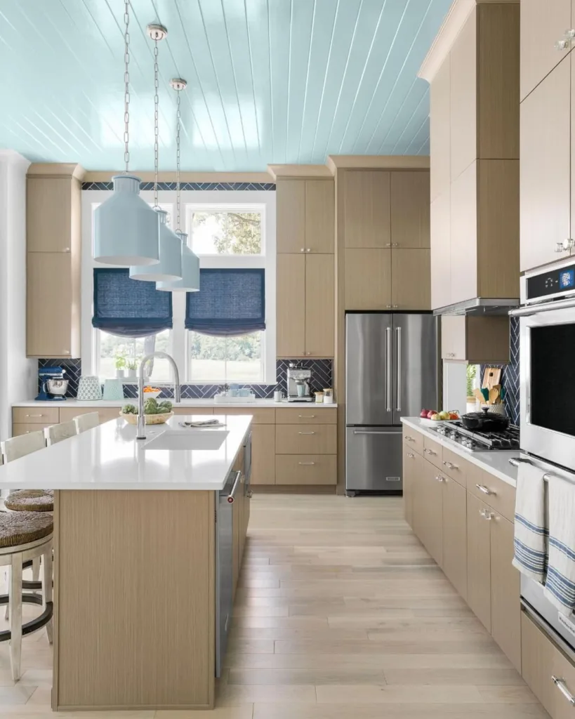 Featuring Floor-To-Ceiling Cabinets, The Breezy, Beachy Kitchen In The Home Kitchen Combines The Best Of Storage And Style. 
