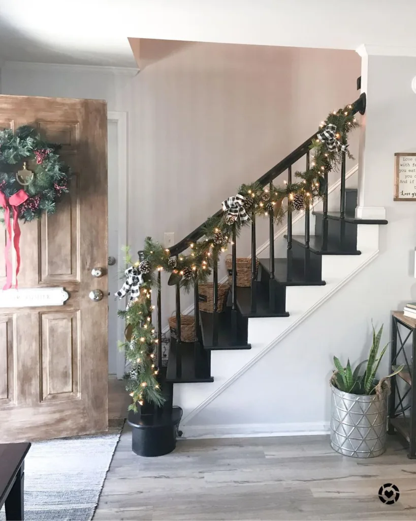 31 Black And White Stairs That Are Sure To Stun 2 Christmas Decor On A Black And White Staircase Entryway With Grey Walls
