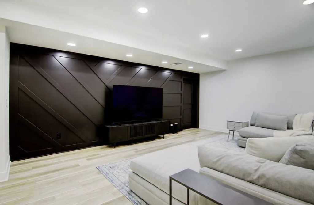 34 Black Accent Wall Ideas For Stunning Contrast 13 A Geometric Accent Wall With Angled Wood Strips Painted Black For A Modern Look