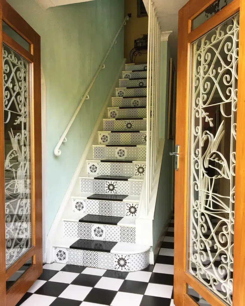 Black And White Mosaic Stairs With White Treads And Polished Black Tile In The Center Of Each Tread