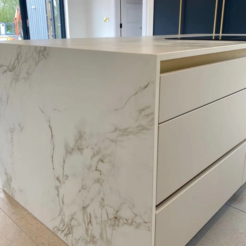 32 Waterfall Kitchen Island Ideas For Inspiration 22 The Waterfall Design Seamlessly Connects The Countertop To The Floor, Creating A Smooth And Elegant Look.