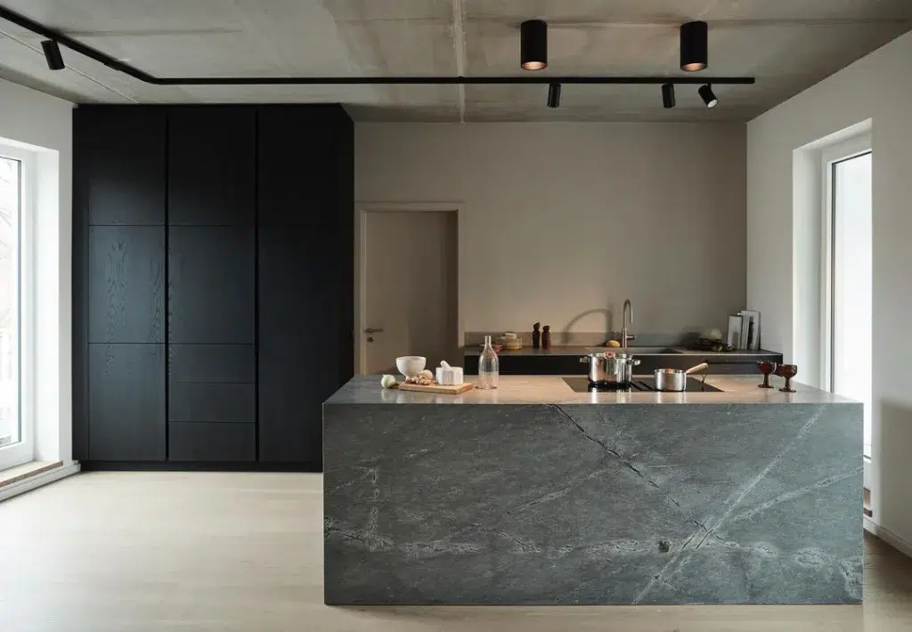 Opening Onto The Living Room, The Kitchen Features A Pure Concrete Ceiling And A Light-Coloured Wooden Floor.