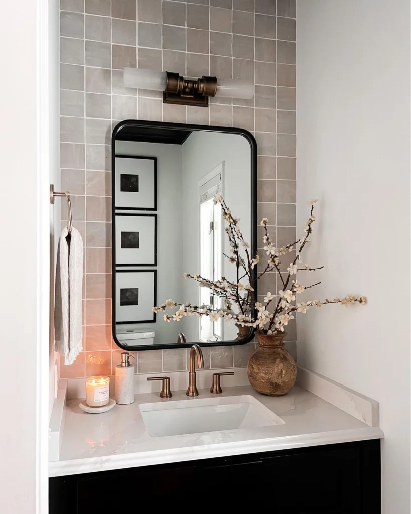 35 Bathroom Counter Decor Ideas 25 A Black Bathroom Vanity With White Countertop And A Wood Vase With Long Twigs As Decor