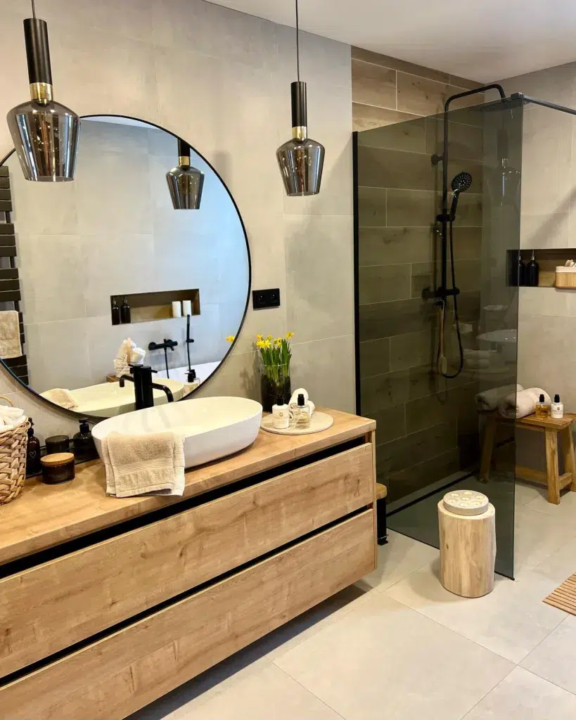 35 Bathroom Counter Decor Ideas 17 A Natural Wood Vanity With Candles And Natural Decor Next To The White Sink With A Black Faucet