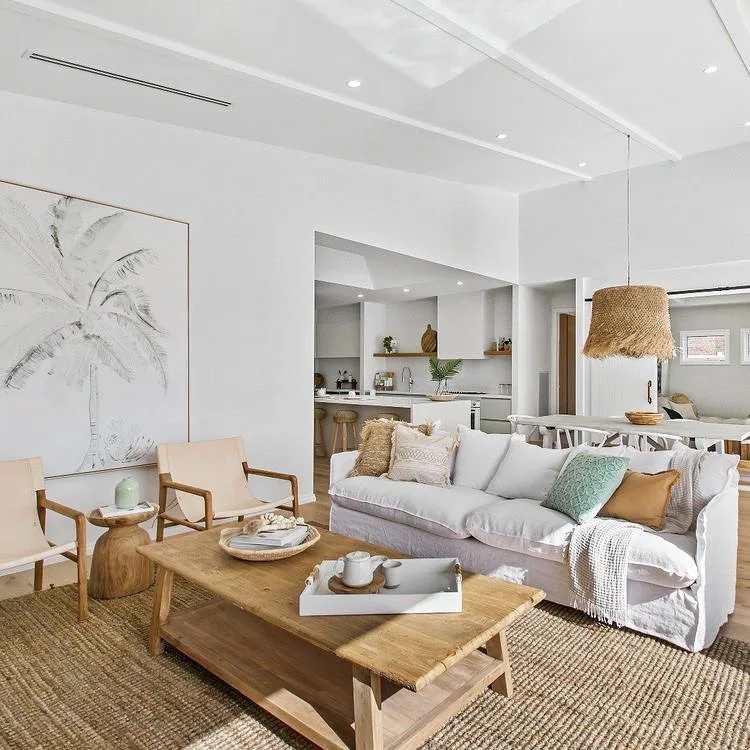 31 Coastal Beach-Themed Living Room Ideas 2 Coastal Living Area With A White Sofa And Neutral Accent Chairs