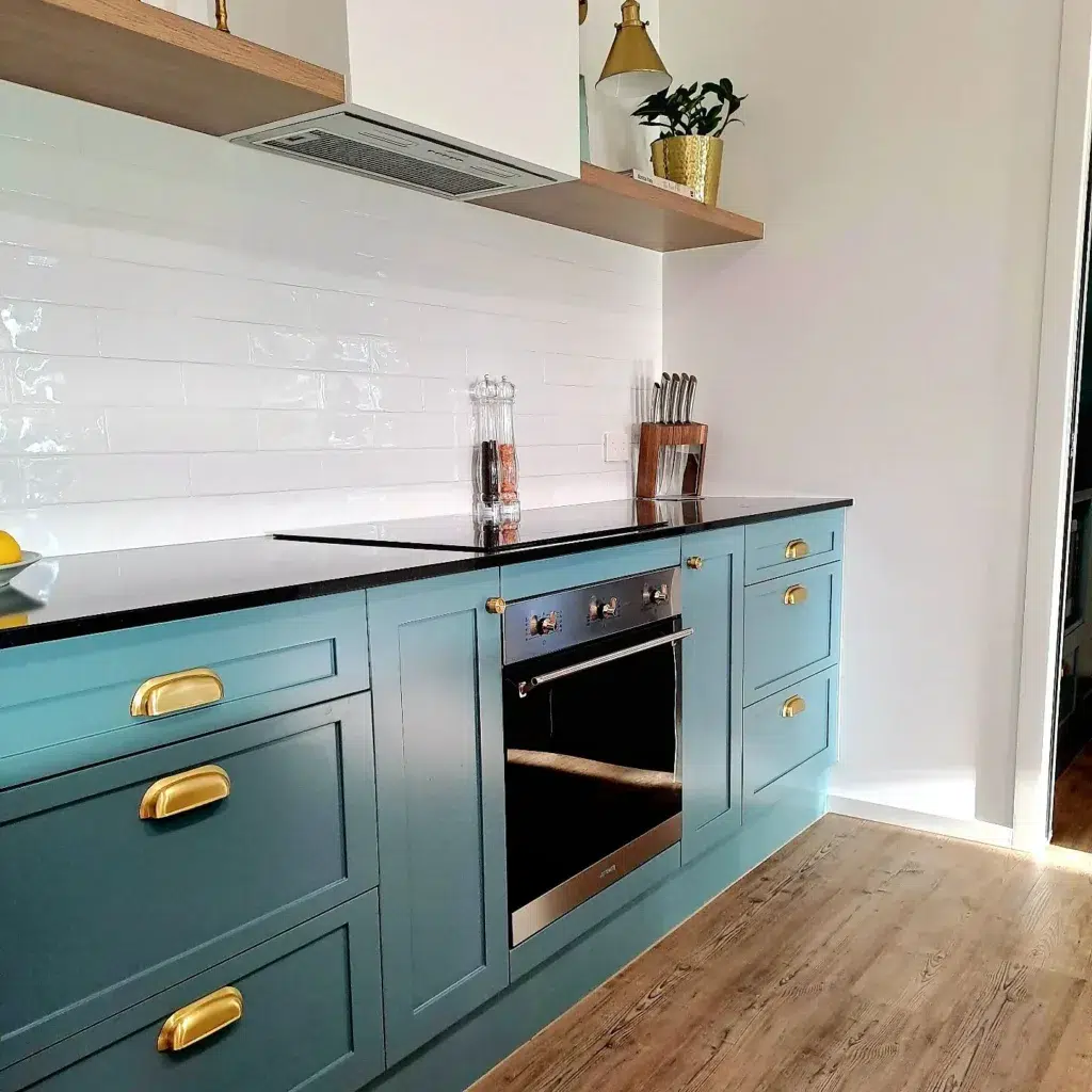 25 Teal Kitchen Cabinets Ideas 2 Light Teal Cabinets With Black Countertops And Wood Shelves Above