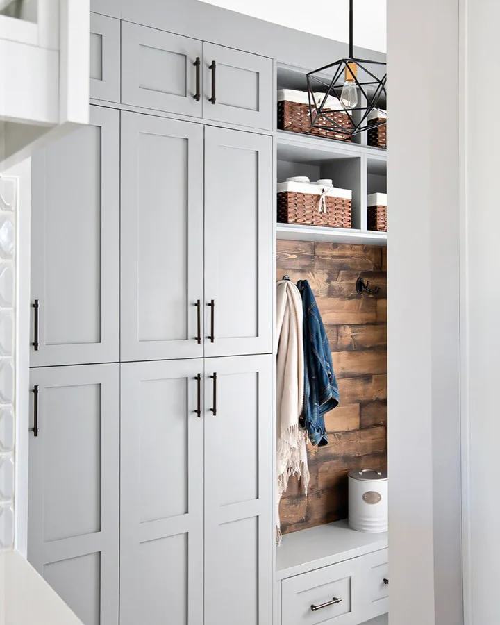 This Mudroom Is All About Stylish Storage And Functionality Including The Hanging, Linen Shelve, Storage Bench, And Some Floor-To-Ceiling Storage Cabinets.