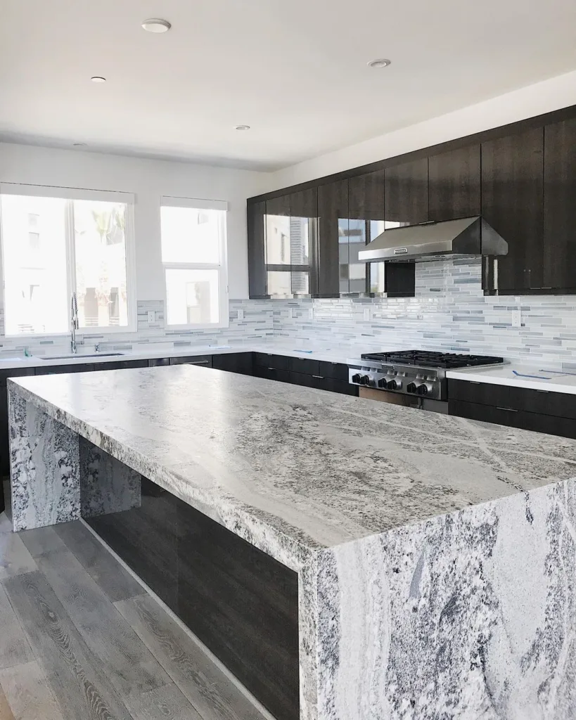 32 Waterfall Kitchen Island Ideas For Inspiration 26 A Waterfall Edge And Extra Thick Slab Used In In Kitchen