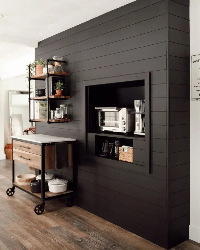 Black Accent Wall In A Kitchen With A Niche For Small Appliances
