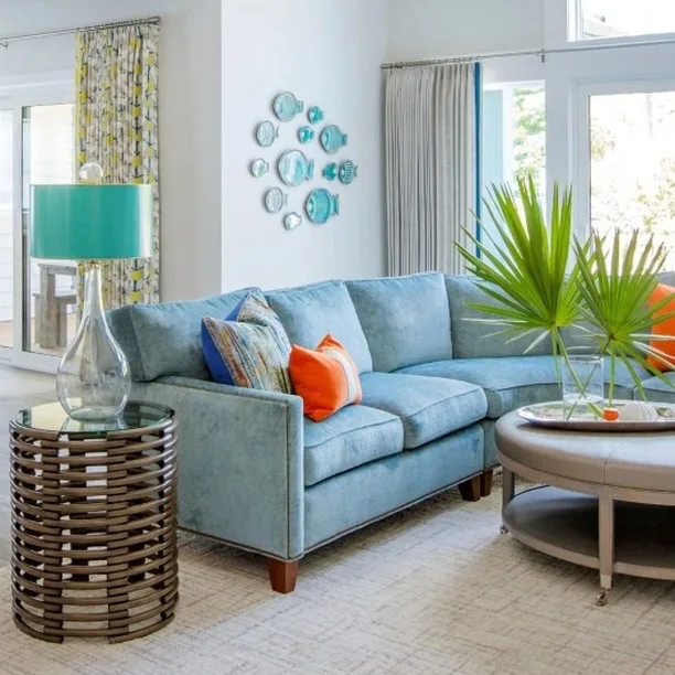 A Blue Sofa With Teal Accents In A Coastal Themed Living Room