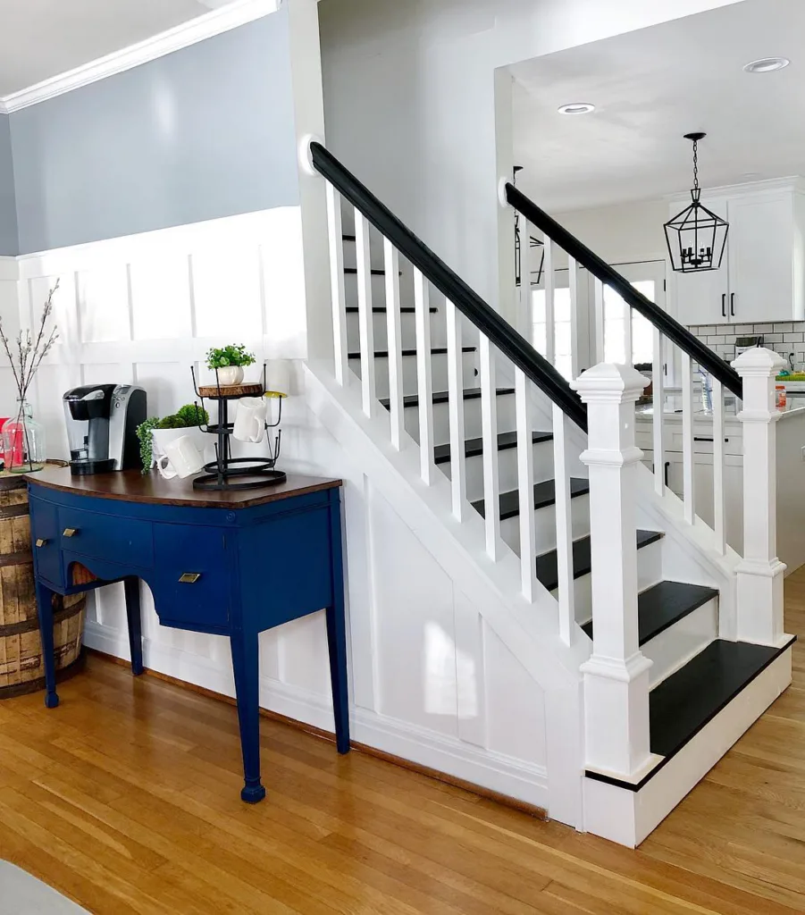 White Railing And White Pillar With Black Handle And The Black Steps