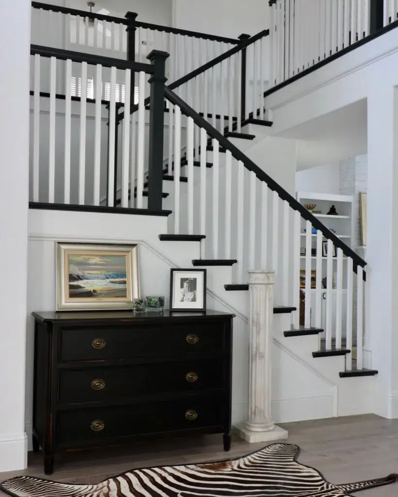 31 Black And White Stairs That Are Sure To Stun 13 Black Treads And Railings On A Staircase With White Spindles To Match The White Walls In The Home