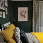 Dark Green Bedroom with Yellow Pillows