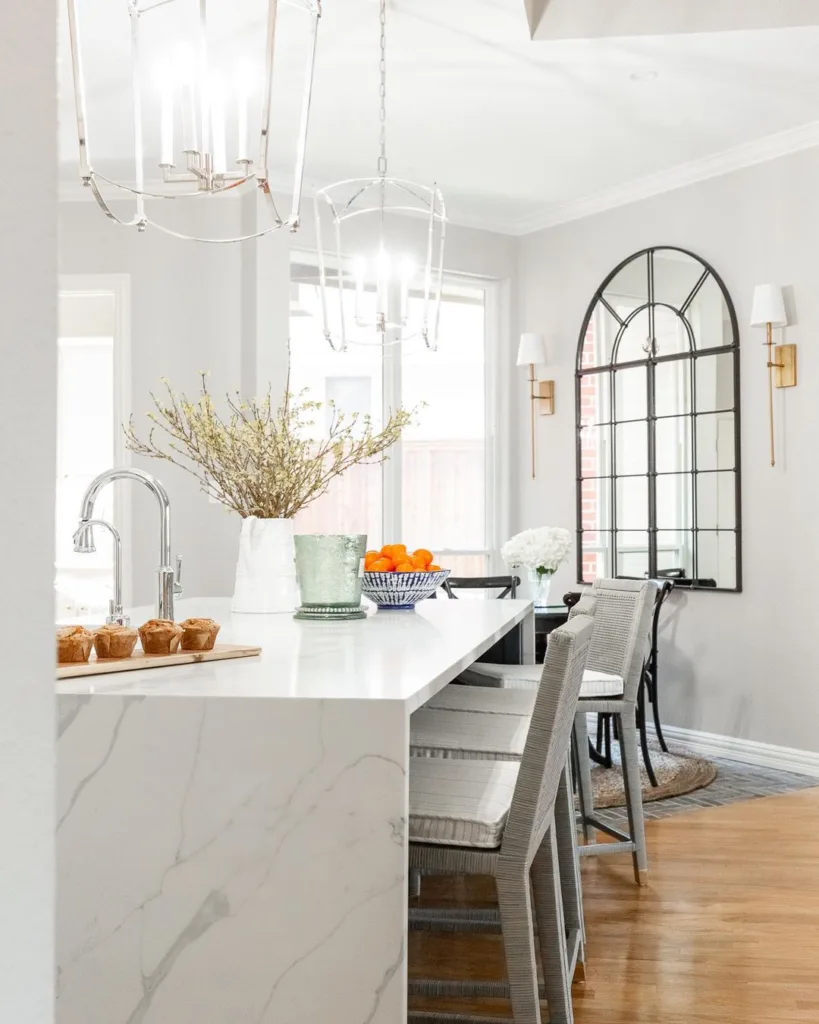 32 Waterfall Kitchen Island Ideas For Inspiration 29 White And Grey Veining In A Modern Counter Island With White Chairs