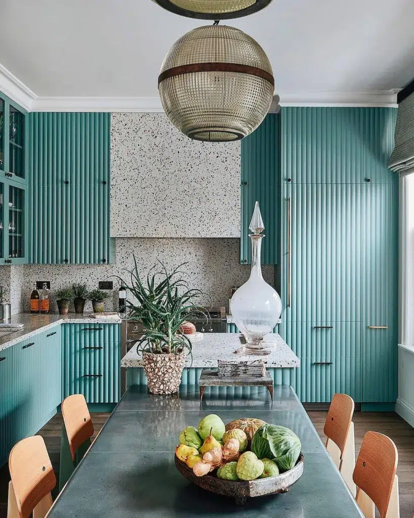Wood Trim Painted Light Teal On The Fronts Of Cabinets In This Art Deco Style Kitchen With Brown Wood Floors