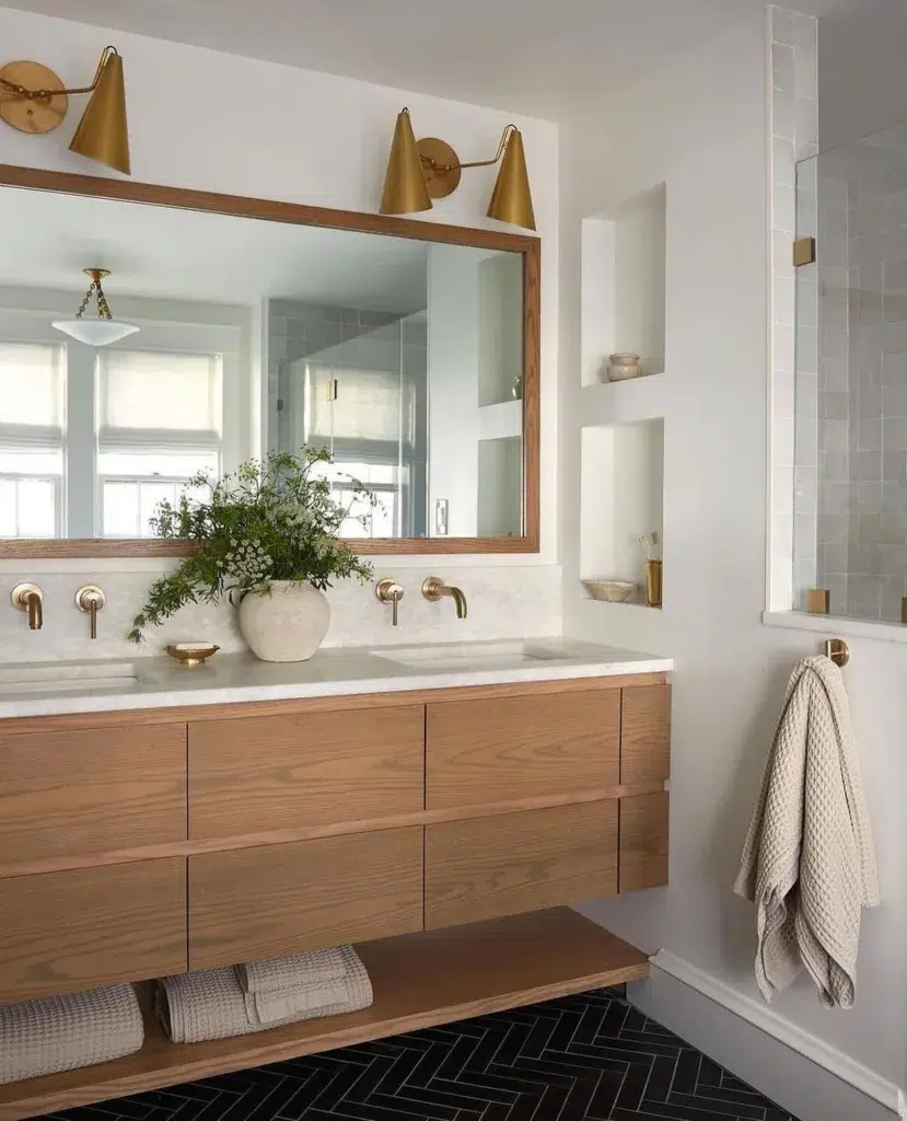 35 Bathroom Counter Decor Ideas 20 A Wood Vanity With A Neutral Planter On The White Countertop