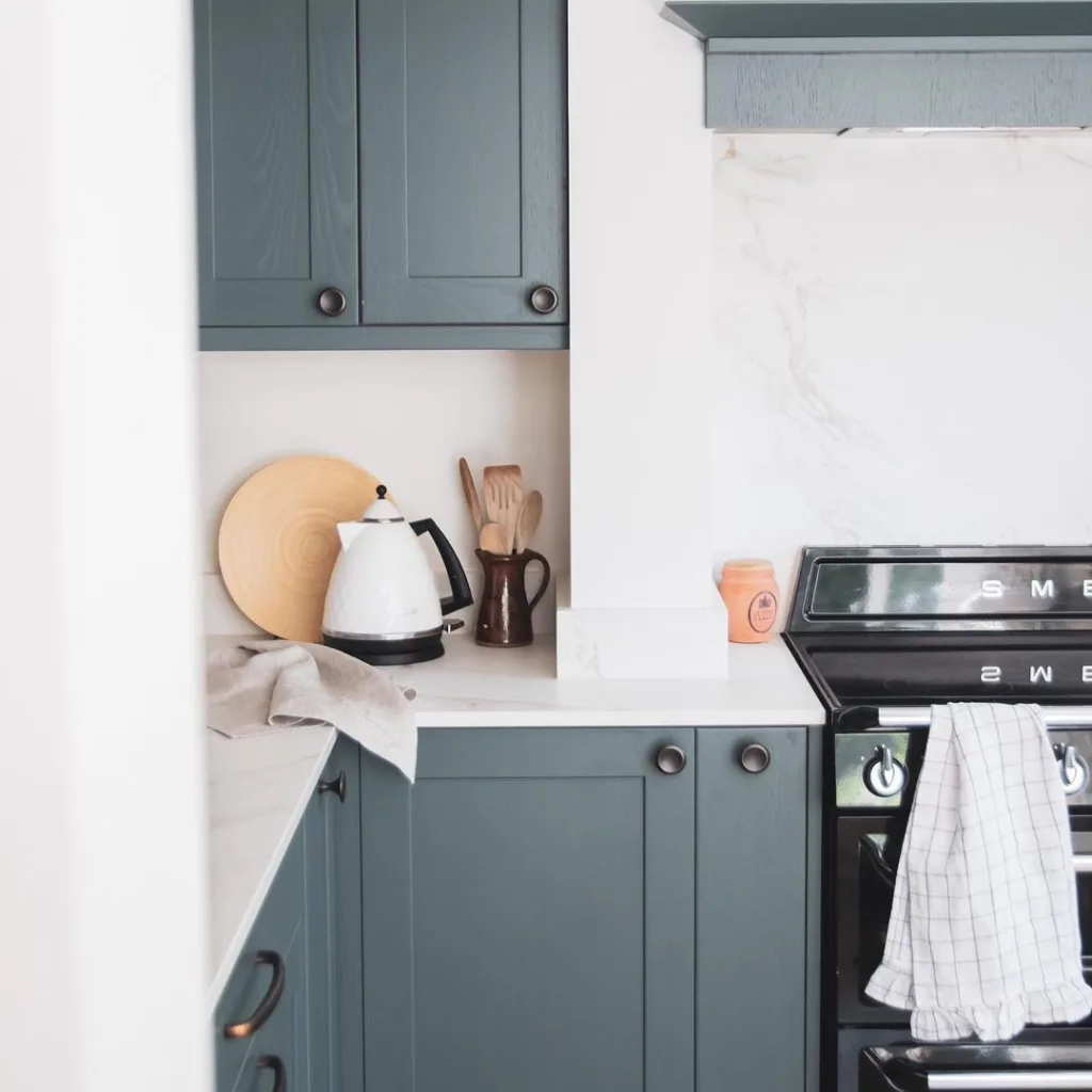 25 Teal Kitchen Cabinets Ideas 9 A Bright And Airy Teal Kitchen With A Quartz Countertop And Backsplash And Black Hardware