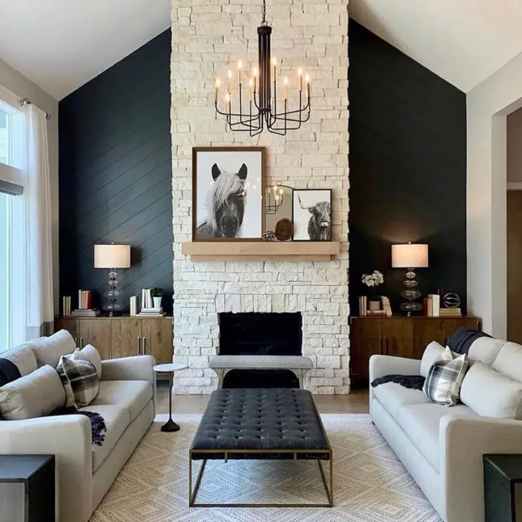 A White Stone Fireplace With Accent Walls On Both Sides For Contrast