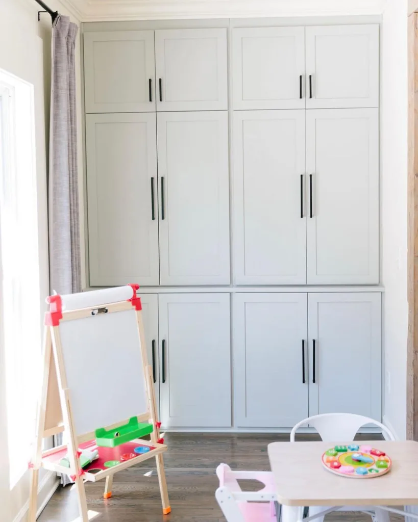 32 Floor To Ceiling Cabinets Ideas To Maximize Storage 12 Floor To Ceiling Cabinets Used For Kids Room With Chair And Table To Study.