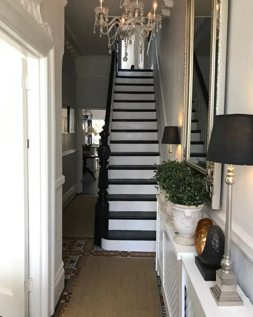 31 Black And White Stairs That Are Sure To Stun 26 Bold And Modern Black And White Stairs In A Narrow Hallway