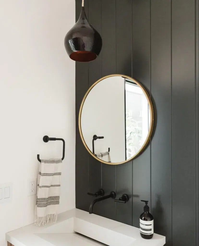 34 Black Accent Wall Ideas For Stunning Contrast 19 A Vertical Shiplap Accent Wall With A Gold Mirror In A Bathroom With A White Sink