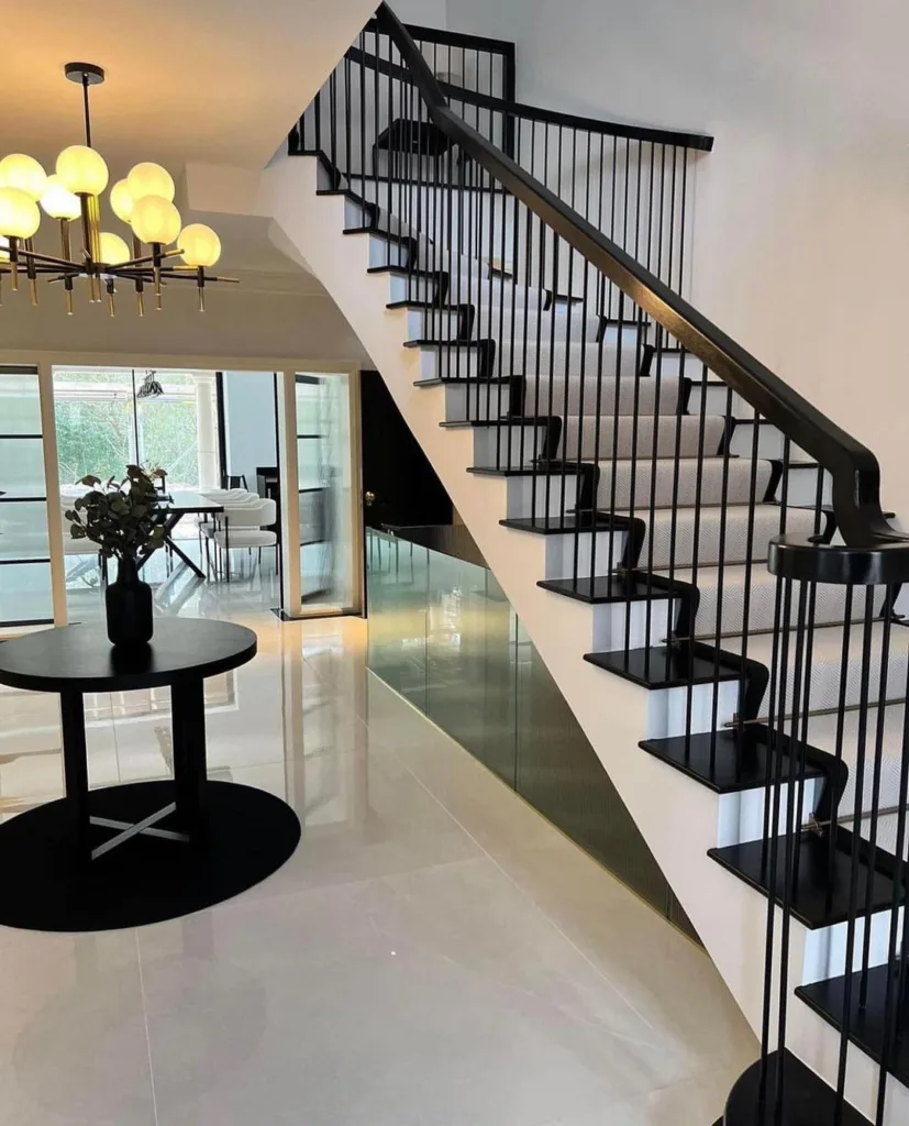 31 Black And White Stairs That Are Sure To Stun 12 A Black And White Staircase In A Modern Entryway With White Polished Tile And Black Walls