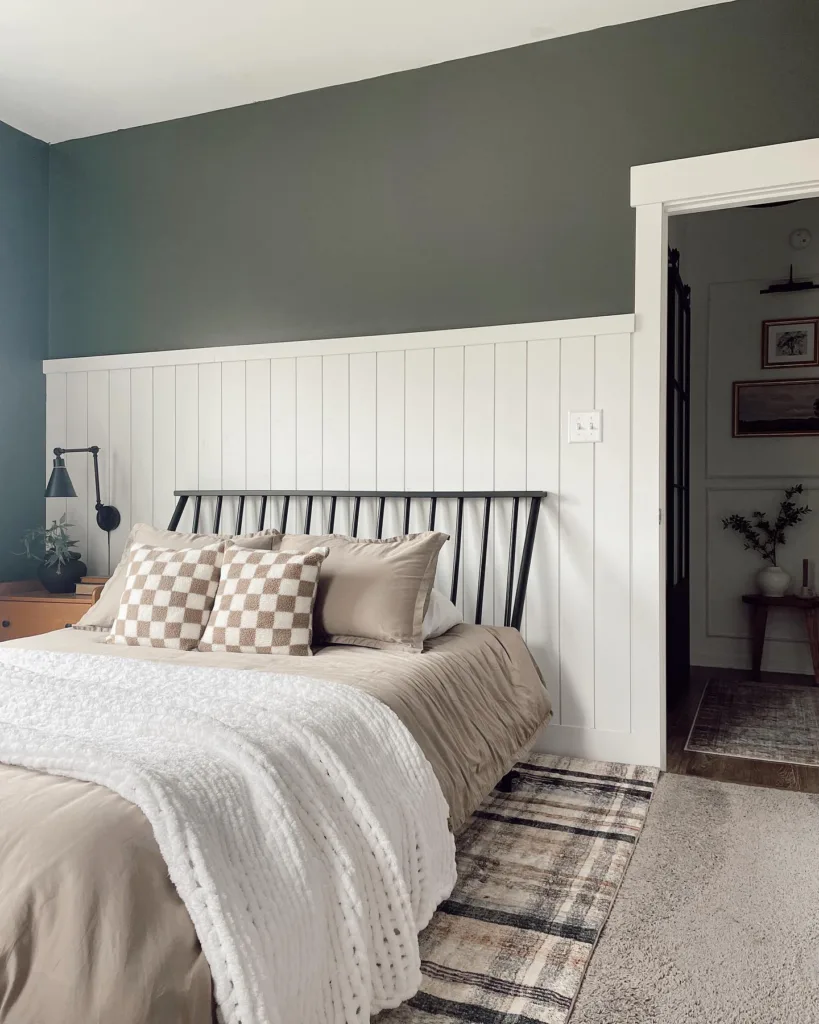 37 Rug Under Bed Ideas For A Stylish Bedroom 18 White Partial Wall Shiplap Behind A Black Metal Bed With Beige Bedding And A Plaid Rug Underneath