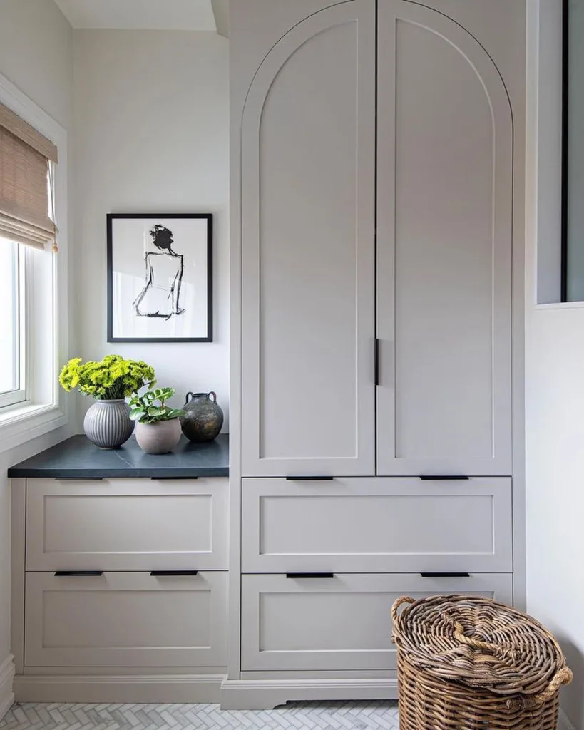 32 Floor To Ceiling Cabinets Ideas To Maximize Storage 6 Floor To Ceiling Cabinets In White Color And Decor With Painting And Green Plants.