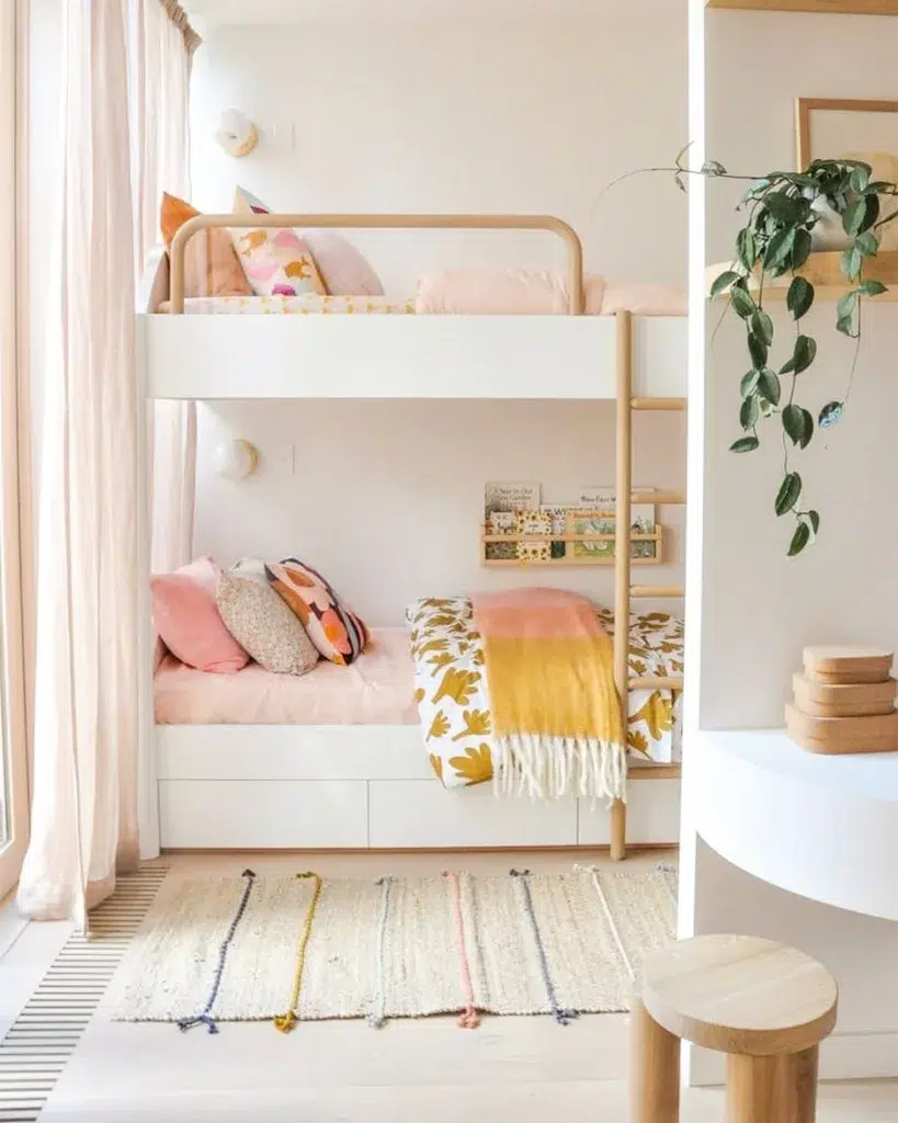 Pink And White Bunk Beds With Natural Wood Accents