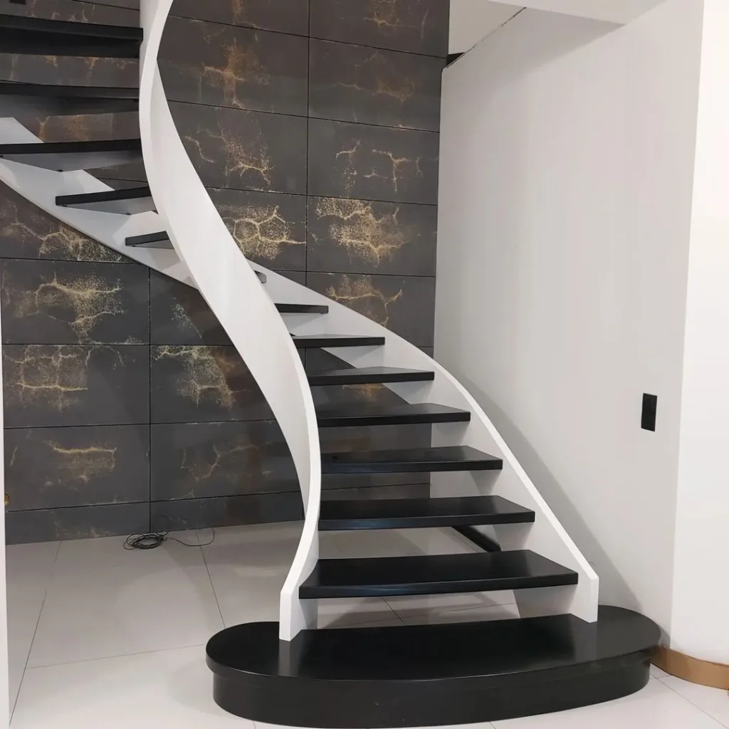 Spiral Design Black And White Stairs. Fully White Railing And Full Black Step With Palain White Wall