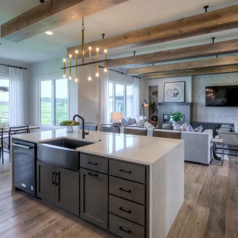 32 Waterfall Kitchen Island Ideas For Inspiration 15 Rustic Wood Beams Over A Green Kitchen Island With White Waterfall Countertops