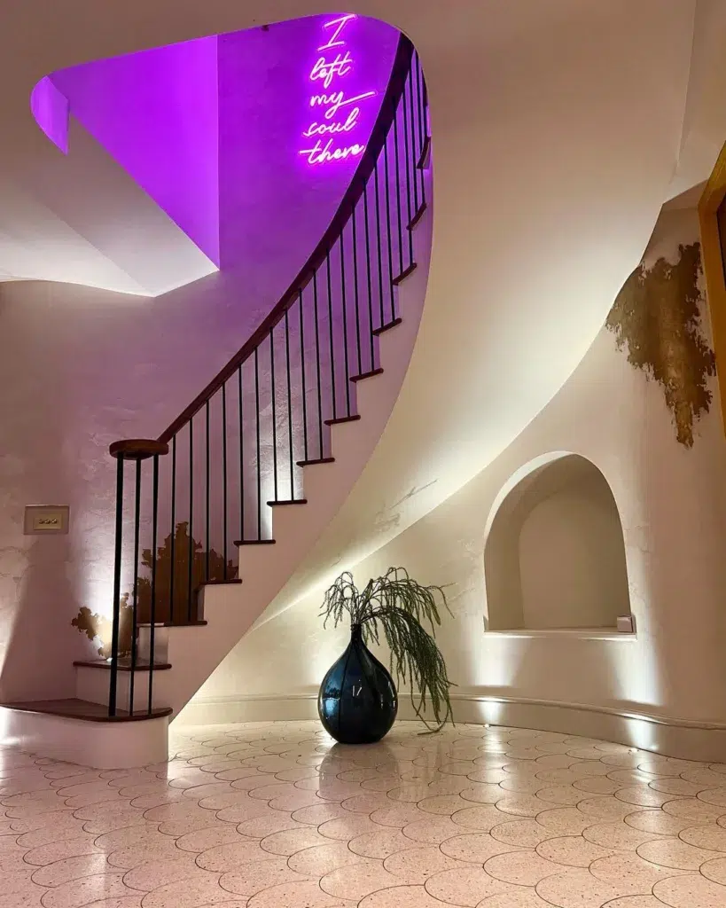 24 Curved Staircases For Design And Decor Inspiration 6 Curved Stairs Leading Up To A Higher Level With A View Of A Neon Light That Says &Quot;I Left My Soul There&Quot;.