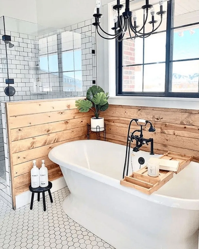 A Charming Wooden Bathroom With Small Hexagonal Tiles Covering The Floor, Adding Texture And Visual Interest To The Space. The Bathtub Is White And Positioned Against The Wooden Wall, Creating A Contrast That Highlights The Natural Beauty Of The Wood. The Wooden Vanity And Mirror Frame Also Complement The Warm And Cozy Feel Of The Room. The Hexagonal Tiles Have A Soft Matte Finish, Creating A Subtle And Elegant Look. 