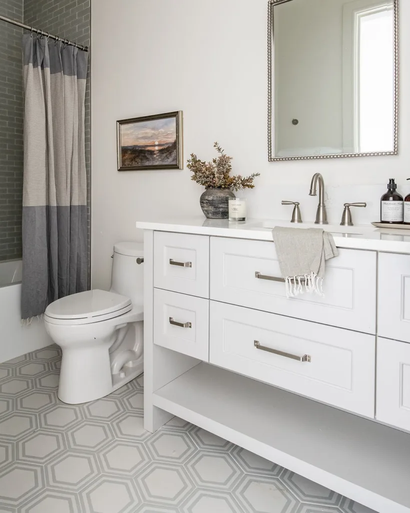 38 Bathrooms With Hexagon Tile Floors 8 A Bathroom With Cream-Colored Hexagonal Tiles Covering The Floor, Creating A Warm And Inviting Atmosphere. The Bathing Area Features A Glass Enclosure, Providing A Clear Separation Between The Shower And The Rest Of The Bathroom. The Door Is White, Providing A Clean And Modern Touch.